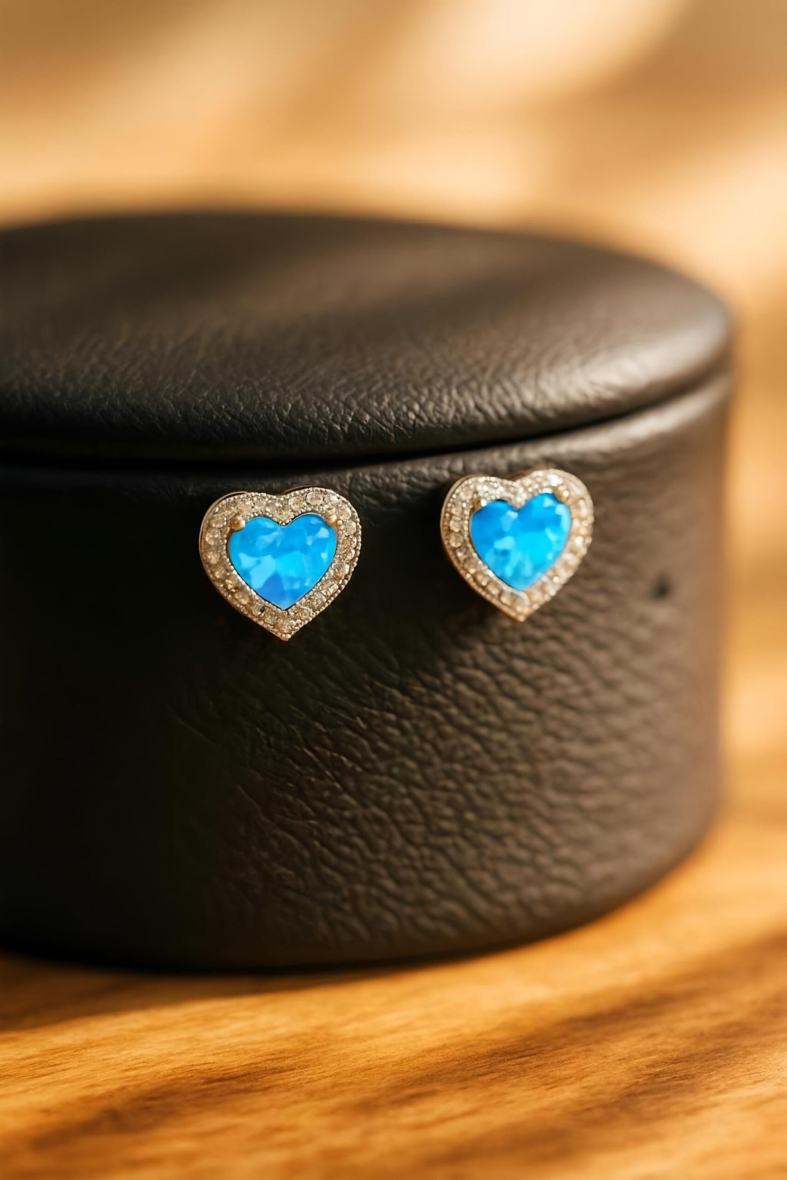 Side angle of Silver CZ & Blue Opal Heart Stud Earrings